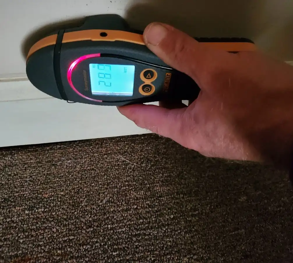 Moisture detection at baseboard during Storm Damage Restoration in Stony Point